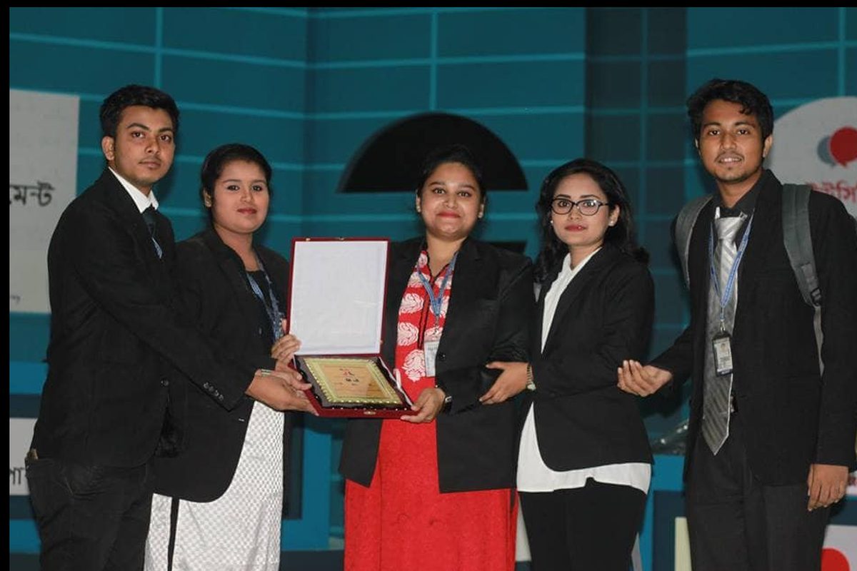 BUBT debate team members receiving crest award at UCB Public Parliament Debate