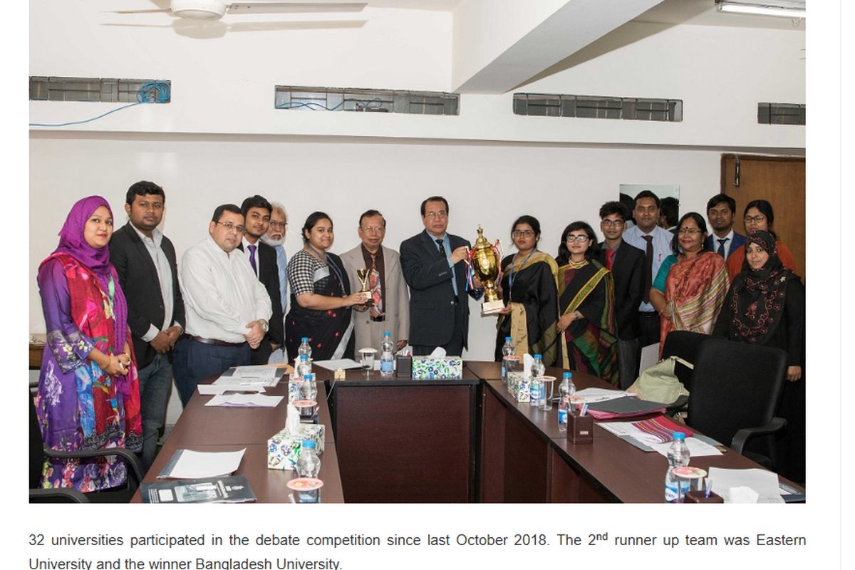 BUBT inter-university debate championship team photo with faculty members and trophy, 2018