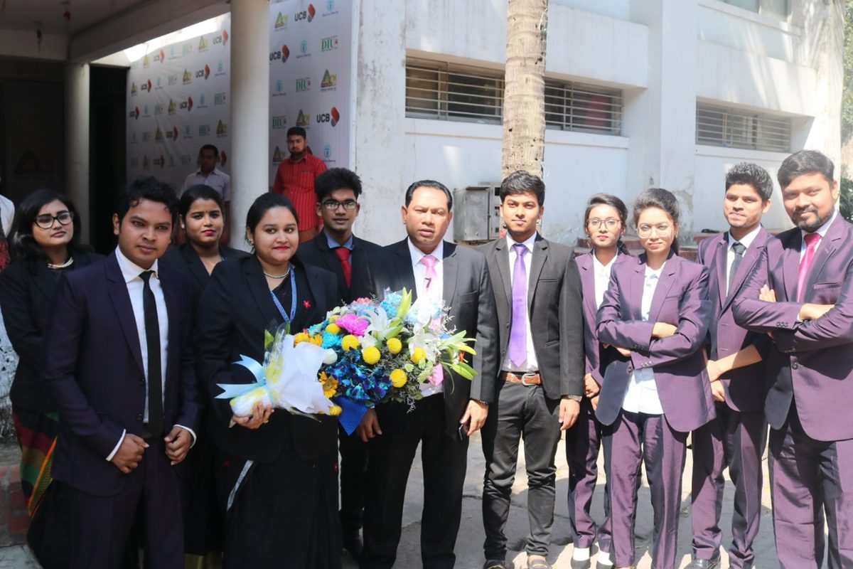 BUBT debate team group photo with faculty advisor at UCB Public Parliament Debate venue